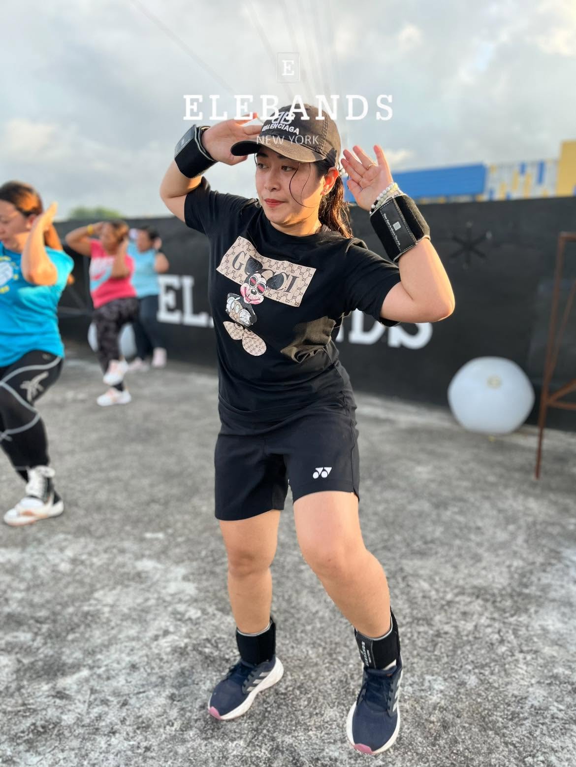 Woman doing an outdoor EleBands fitness workout