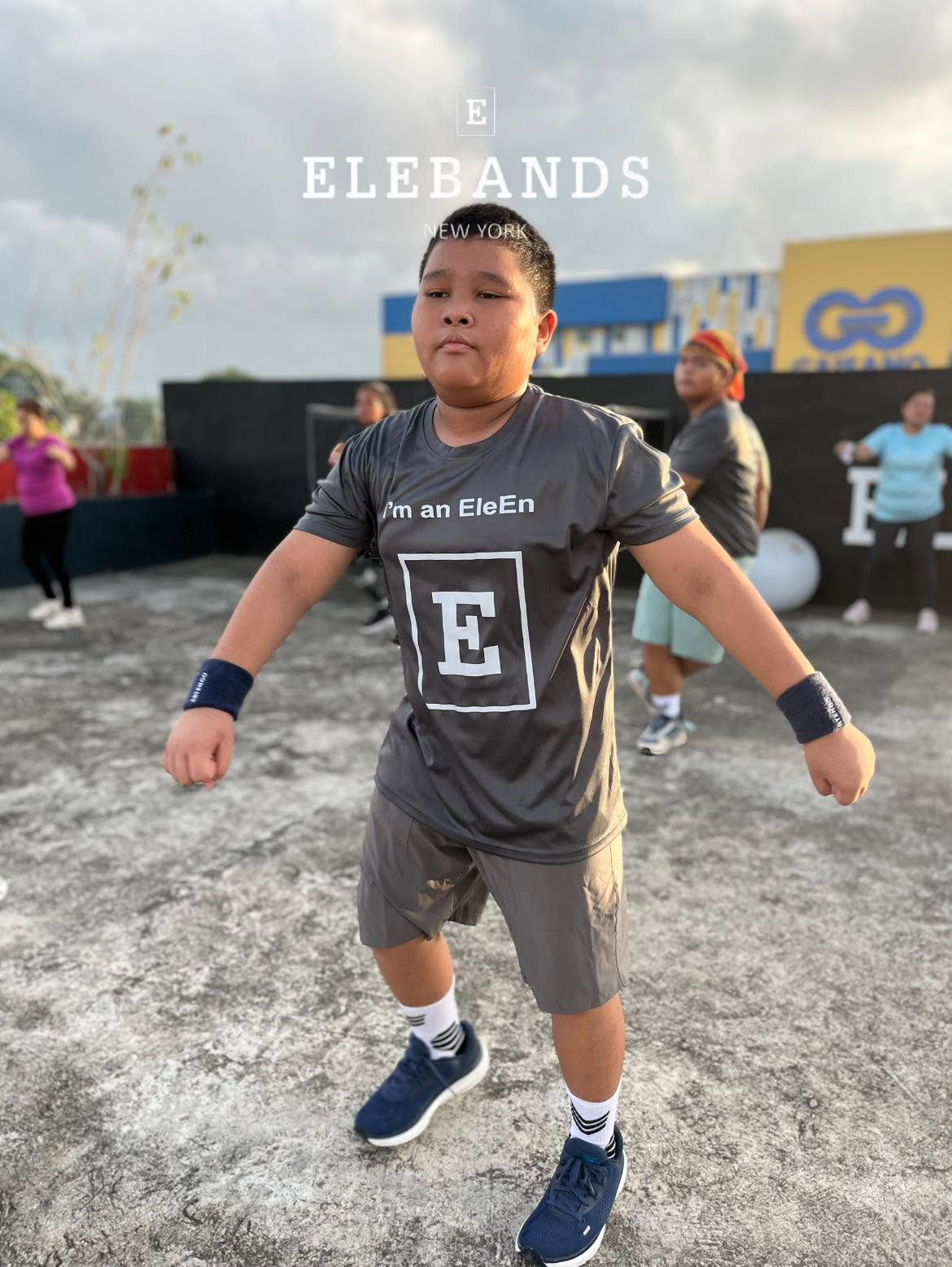 Young athlete exercising outdoors with EleBands wrist weights