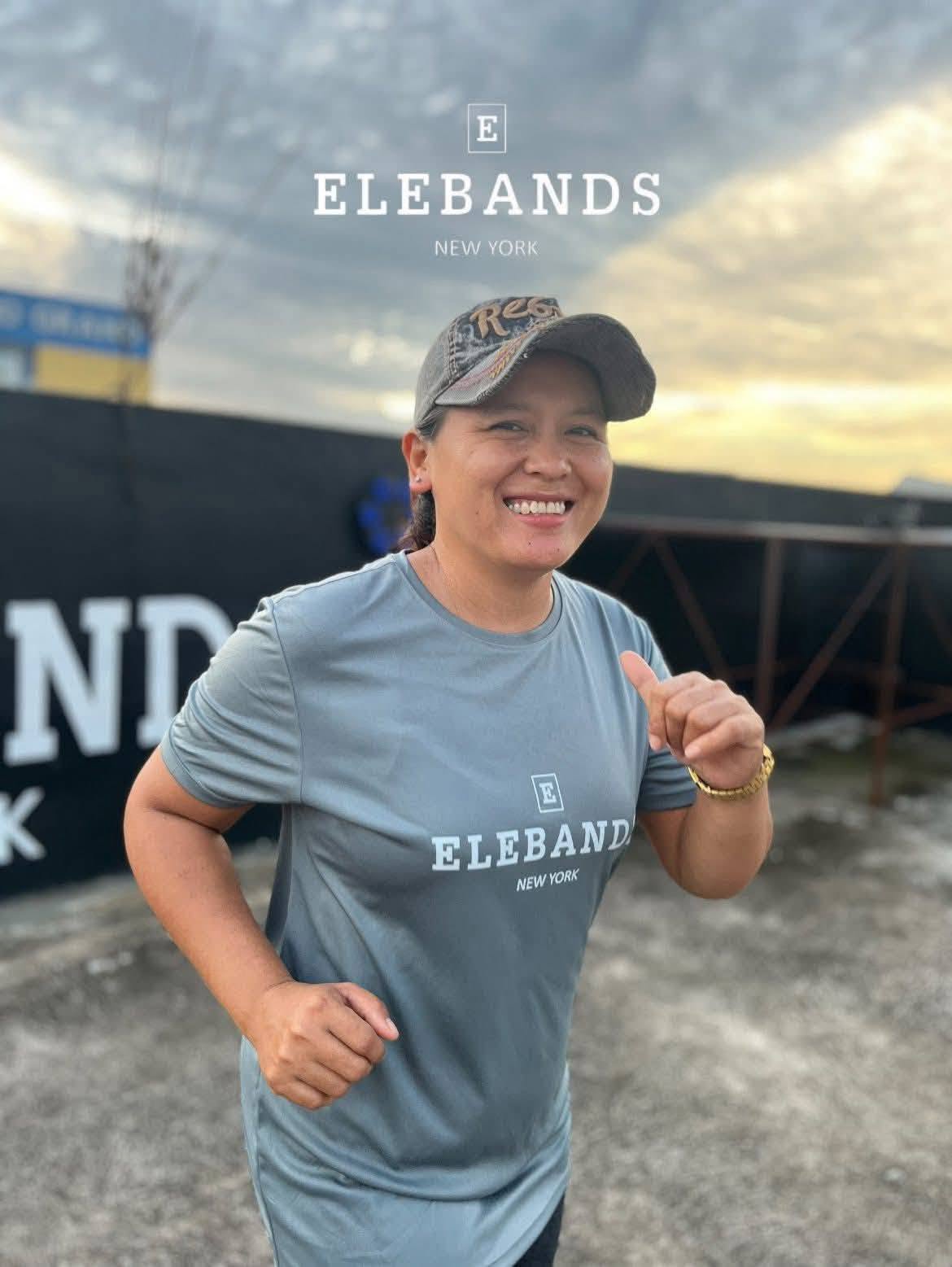 Smiling woman participating in an EleBands outdoor workout