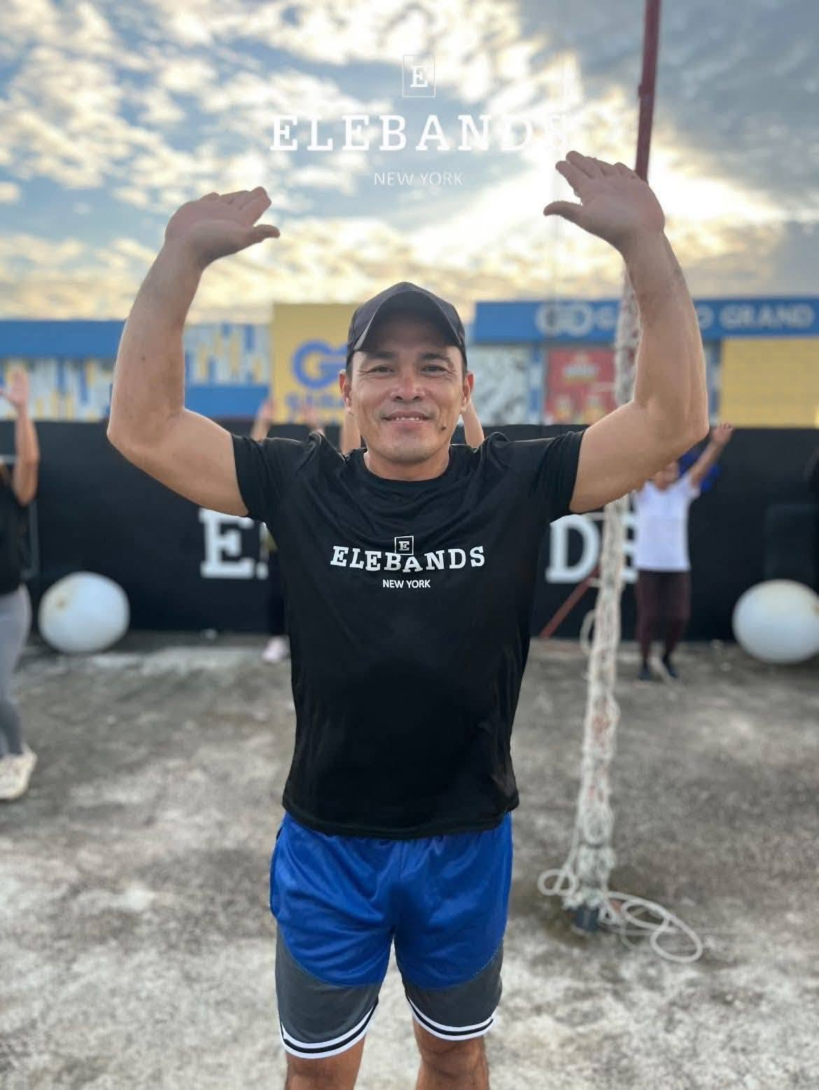 Man celebrating during an EleBands community fitness event
