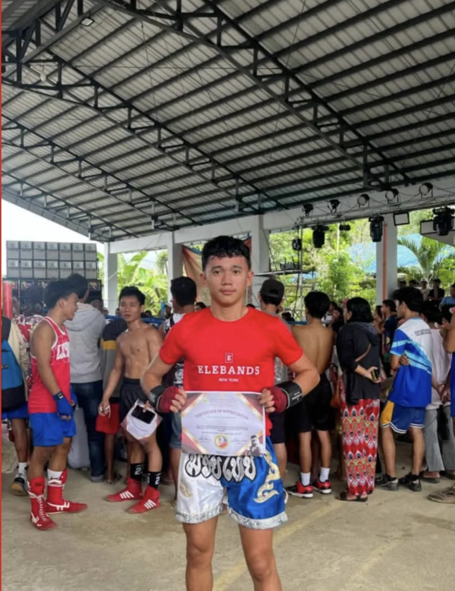 Athlete wearing EleBands wrist weights at a community training event