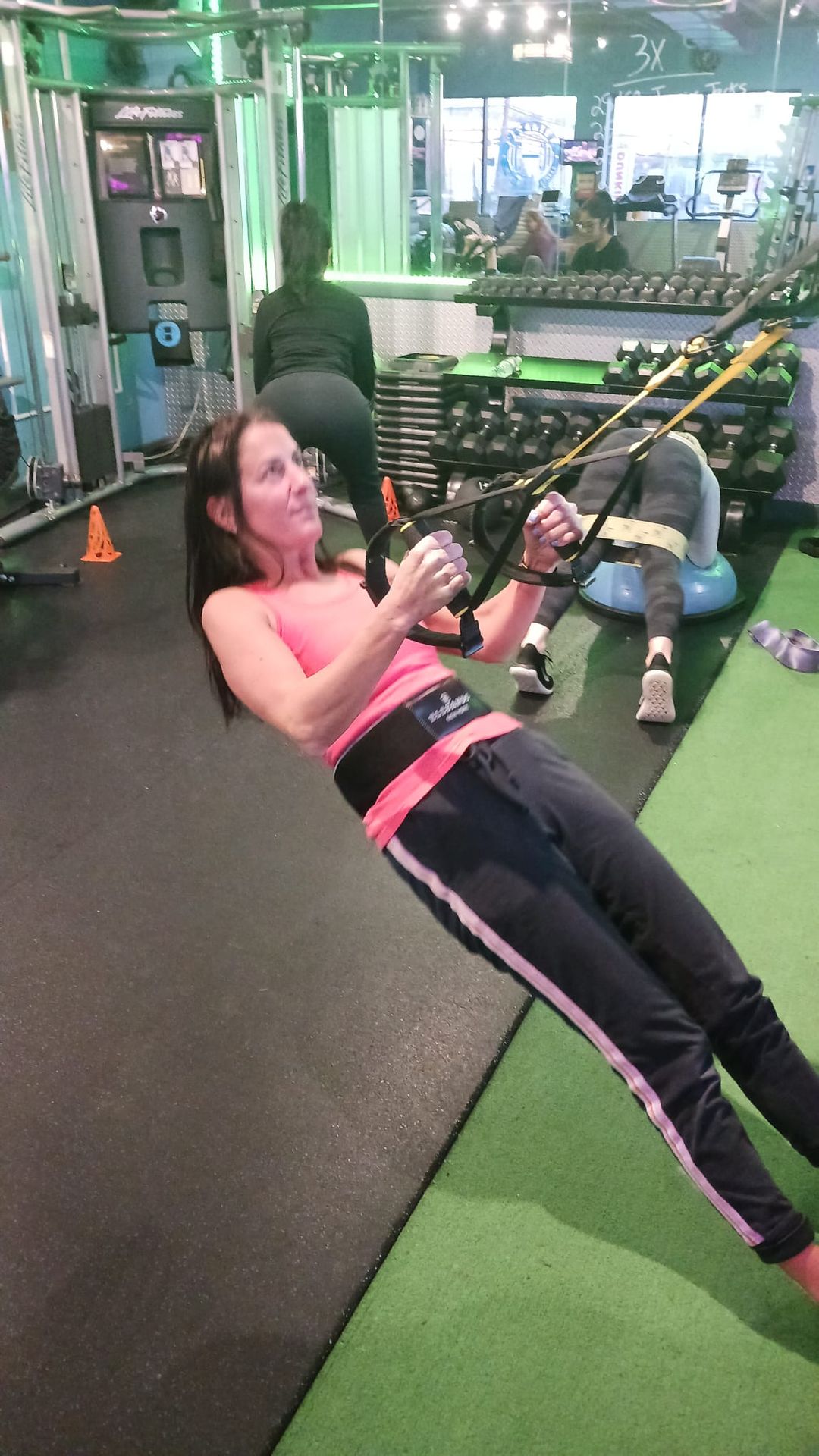 Woman exercising with EleBands waist and wrist weights