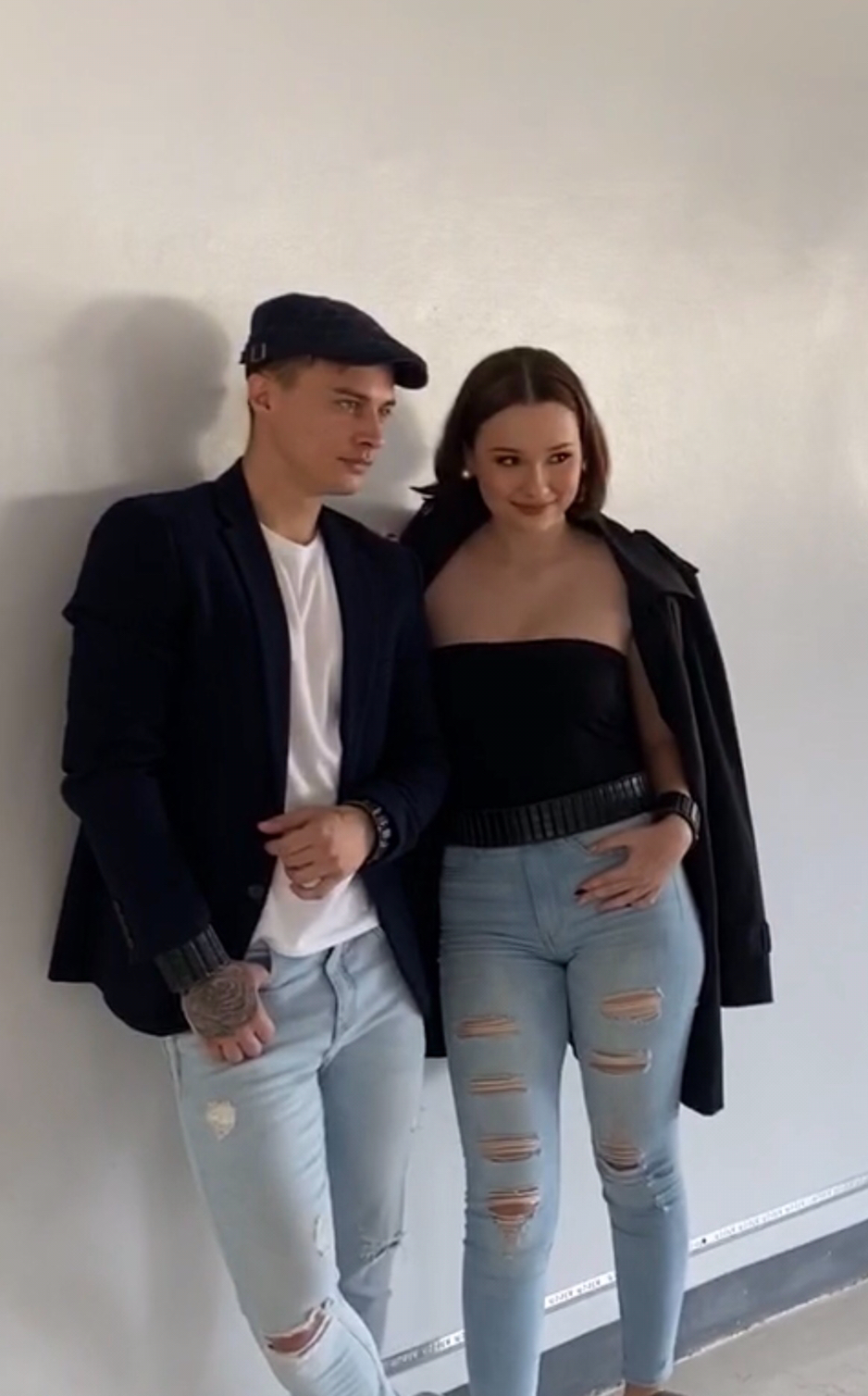 Couple modeling EleBands waist weights with coordinated outfits