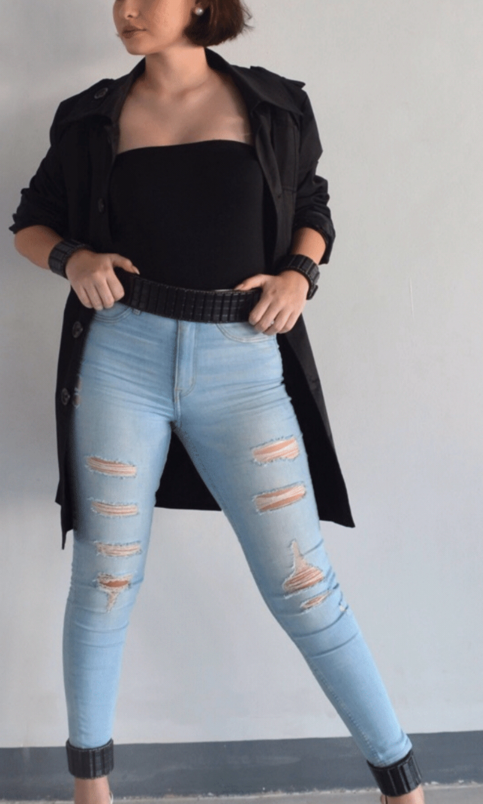 Woman modeling EleBands waist weights with a casual outfit