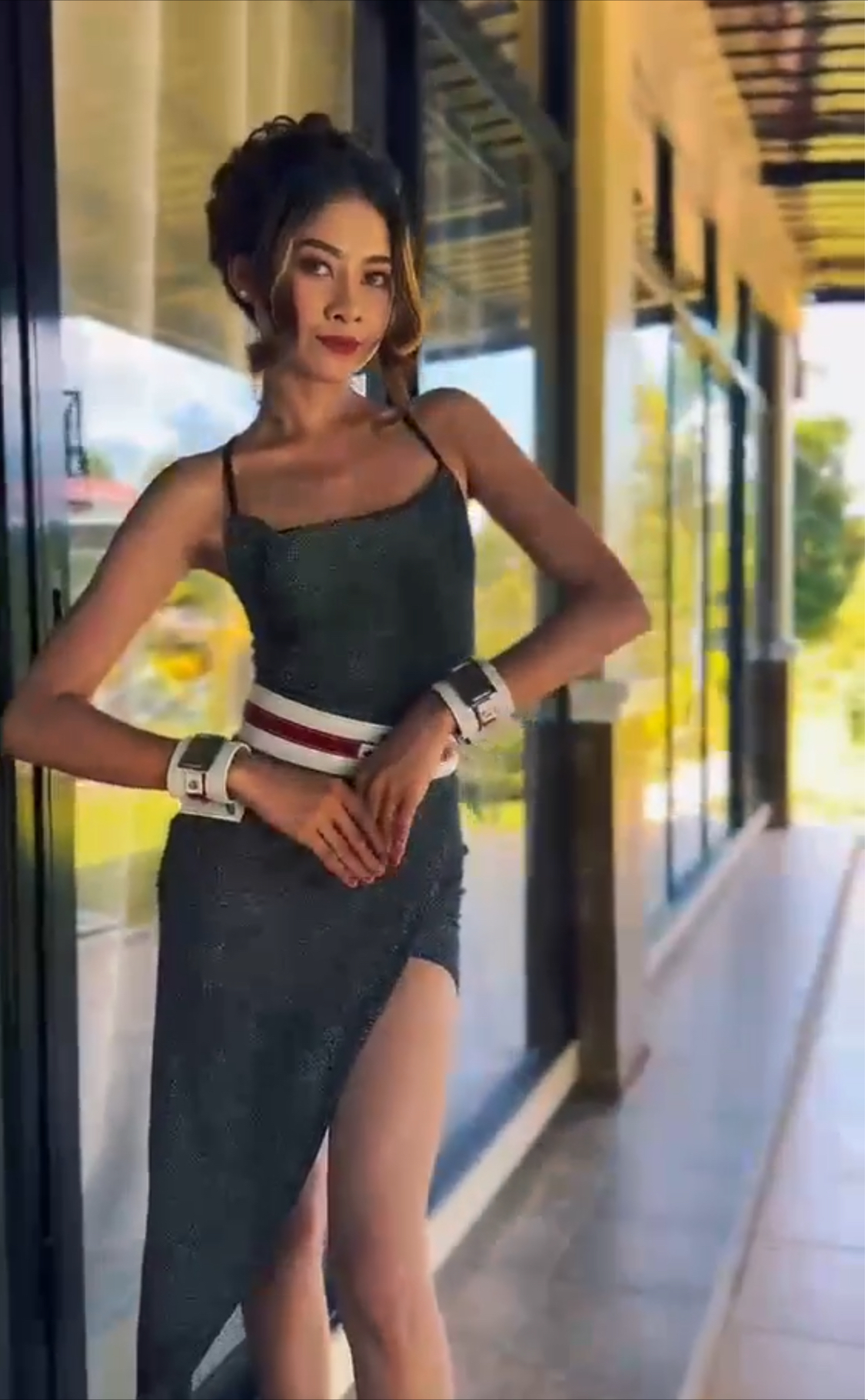 Woman modeling EleBands waist weights with a black dress
