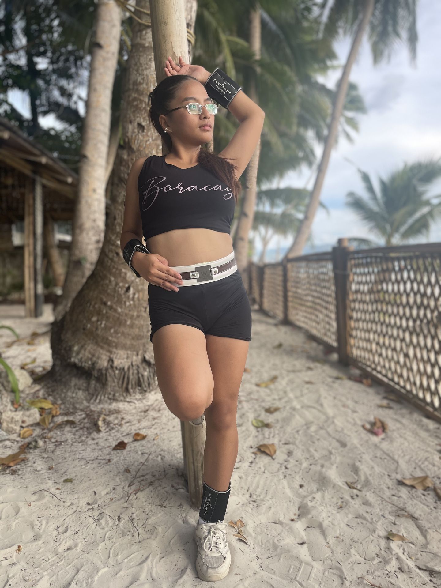 Woman wearing EleBands waist and ankle weights on the beach